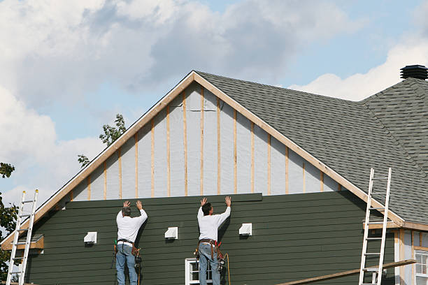 Professional Storm Damage Siding Repair technician working in Hines, OR
